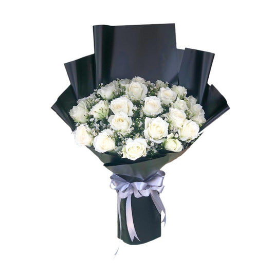 Fierce Dreams Bouquet: Embrace the allure of our Fierce Dreams Flower Bouquet. Two dozen pristine white Baguio roses accompanied by delicate aster fillers, capturing the essence of beauty and love. Wrapped in sleek black Korean film and finished with a silver ribbon, this arrangement exudes elegance and sophistication.