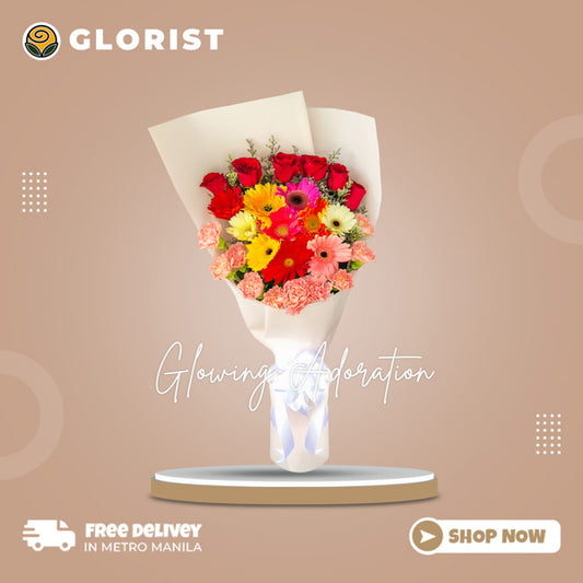 Stunning floral arrangement featuring gerberas, carnations, red roses, and misty blue fillers in a Korean wrap. Enhanced with satin ribbon for an elegant touch. Perfect for weddings, special occasions, and gifts.