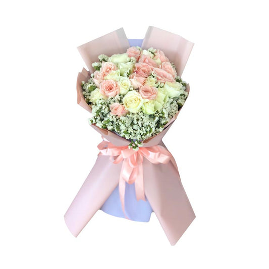 Exquisite bouquet showcasing a delightful combination of light pink and white roses, accentuated by delicate Statice fillers, elegantly wrapped in a Korean-inspired style.