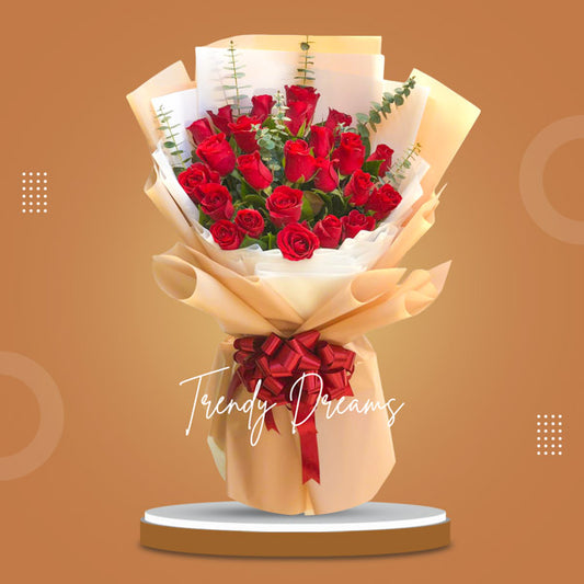 Trendy Dreams: An exquisite arrangement featuring 12 passionate red roses, accompanied by eucalyptus fillers, creating a bold and impactful display of beauty and romance.