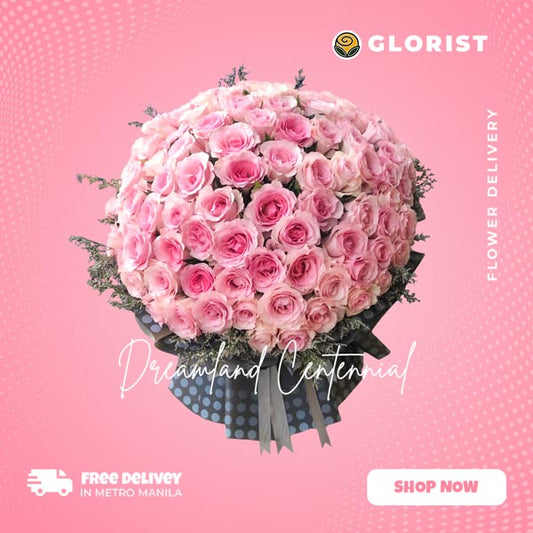 Exquisite bouquet featuring 100 stunning pink Ecuadorian roses, accompanied by delicate misty blue fillers, presented in an elegant Korean-style packaging and finished with a luxurious satin ribbon, creating a truly captivating and romantic floral arrangement.
