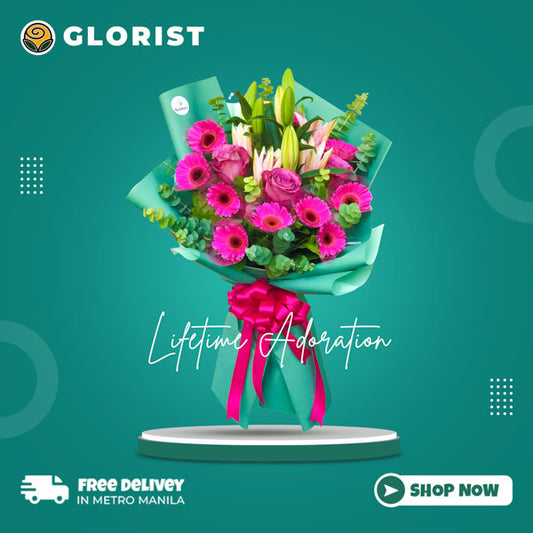 Stunning floral arrangement featuring 10 dark pink gerberas, 3 purple roses, and stargazer lilies, adorned with eucalyptus fillers in an emerald Korean wrap tied with fuchsia pink satin ribbon. Enhanced with satin ribbon for an elegant touch. Perfect for weddings, special occasions, and gifts.
