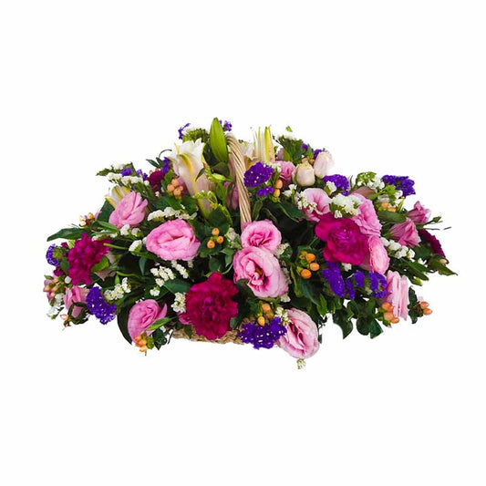 A captivating basket filled with Stargazer lilies, red carnations, and pink lisianthus, accompanied by beautiful violet and white statice and hypericum berries. Perfect for expressing your love and admiration on any occasion. Order now and brighten someone's day.