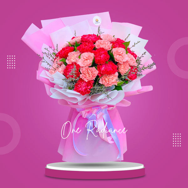 Stunning bouquet: light and dark Pink Carnations with Misty Blue Fillers. Artfully arranged in Korean-style wrap, adorned with Satin Ribbon.