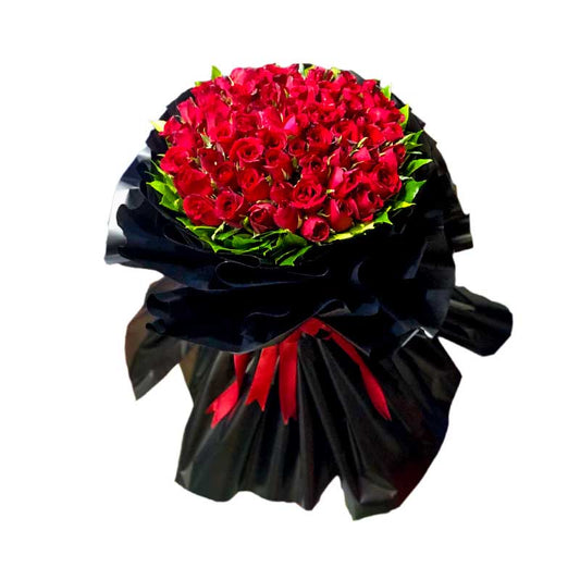 Captivating Bouquet: A lavish arrangement of 60 stunning red roses elegantly wrapped in a Korean-style packaging, complete with a luxurious satin ribbon. This exquisite bouquet is sure to make a lasting impression and add a touch of elegance to any occasion. Order this captivating bouquet of 60 red roses today and make a statement of love and beauty.