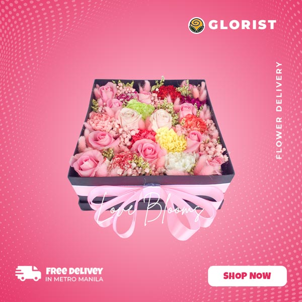 Exquisite box flower arrangement: Fuchsia and light pink Ecuadorian roses, assorted carnations, gypsophila, bunny tail grass, and misty yellow fillers.
