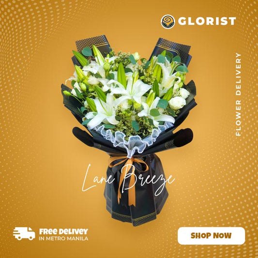 A stunning bouquet featuring three beautiful white stargazer lilies with lisianthus, golden rods, and silver dollar eucalyptus leaves. This exquisite arrangement is expertly wrapped in a Korean-style wrap, adorned with a luxurious satin ribbon. Celebrate any occasion with this enchanting bouquet of flowers, designed to impress and delight.
