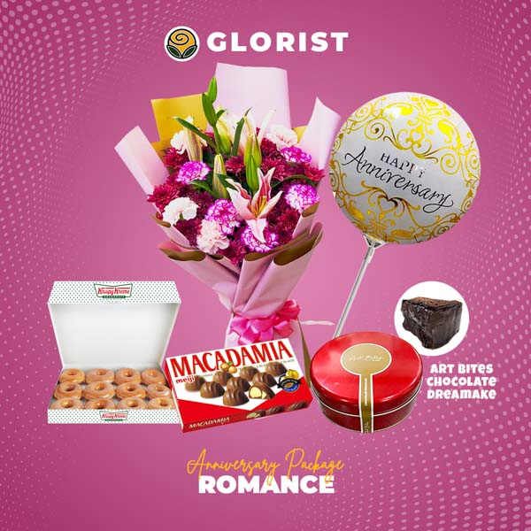 Captivating bouquet featuring a combination of carnations and stargazer lilies, mouthwatering Art Bites chocolate dream cake, delightful box of Krispy Kreme doughnuts, enchanting Macadamia chocolate, and celebratory anniversary balloon thoughtfully included in this remarkable package.