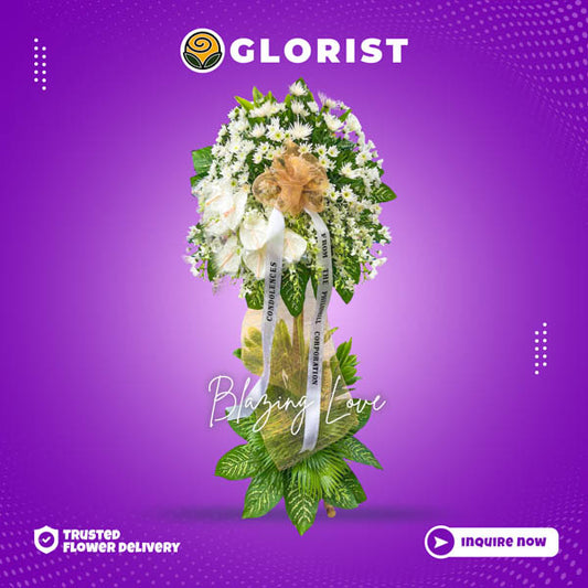 Serene funeral flower stand: Malaysian Mums elegantly arranged with white anthurium accents and Anahaw leaves, conveying heartfelt sympathy and solace.