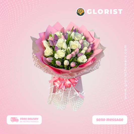Captivating bouquet featuring white rose, white, pink, and purple tulips, expertly arranged in a Korean wrap and embellished with a luxurious satin ribbon. This stunning floral arrangement is perfect for any special occasion, adding beauty and charm to your celebrations.