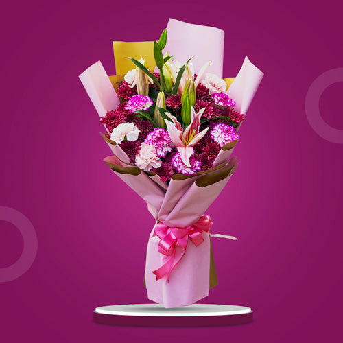 Compassionate Love Bouquet featuring stargazers, carnations, and Malaysian mums in a vibrant and meaningful floral arrangement.