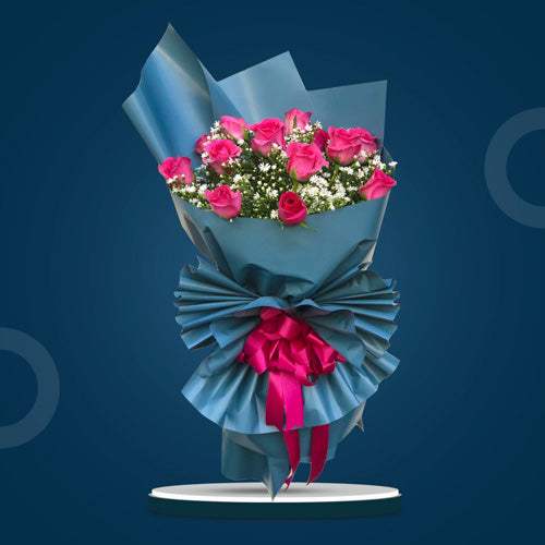 Dazzling Dreams bouquet featuring 1 dozen dark pink roses with aster fillers for a captivating, elegant display.
