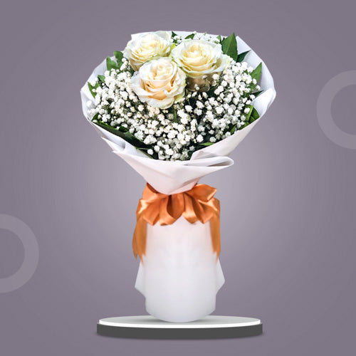 Dreamland Purity Bouquet: Three imported white Ecuadorian roses with rosal and gypsophila baby’s breath in white Korean film - delicate and elegant flower arrangement for special occasions - flower delivery in San Miguel, Bulacan