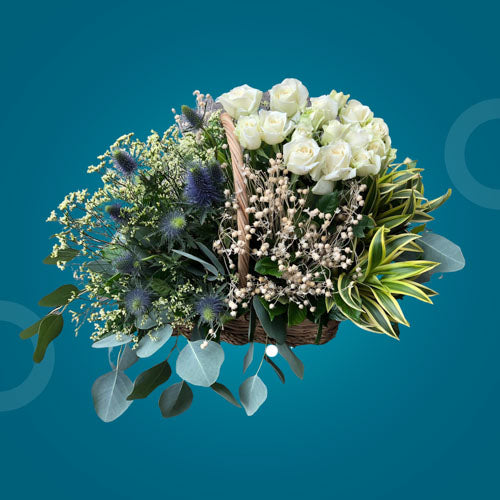 Eastern Fantasy Flower Basket featuring white roses and imported fillers in an elegant and timeless arrangement.