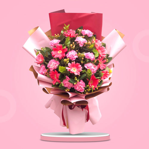 Captivating Floral Ensemble: Pink gerberas, light pink carnations, and hypericum berries in two-tone Korean wrap with satin ribbon - elegant flower arrangement for special occasions - flower delivery to Eastwood Mall and Century City Mall