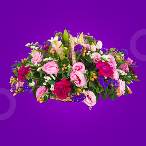 Exquisite flower basket featuring a Stargazer Lily, 10 Red Carnations, Pink Lisianthus, Violet and White Statice, and Hypericum Berries in a beautifully arranged presentation.