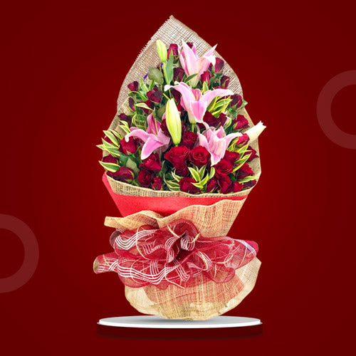 Fiery Breeze bouquet featuring 3 Stargazers, 3 dozen red roses, and yellow corn leaves for a radiant, passionate display.