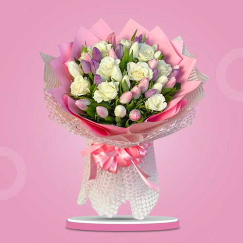 Captivating bouquet featuring 10 white roses, 10 white, pink, and purple tulips in light pink Korean wrap with satin ribbon - stunning flower arrangement for special occasions - flower delivery to Sta. Lucia East Grand Mall and SM City Baliwag