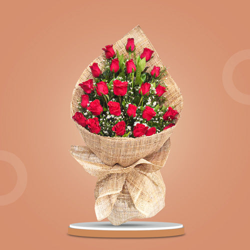 Happy Dreams Bouquet featuring 24 vibrant red roses and elegant aster fillers in a timeless romantic arrangement.