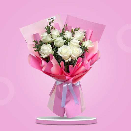 Brighten any moment with the Jaunty Flora Bouquet: 10 white China roses & eucalyptus parvi wrapped in two‑toned pink. Same‑day Metro Manila delivery.