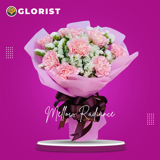 Vibrant pink carnation arrangement with delicate statice fillers, creating a stunning contrast of colors and textures.