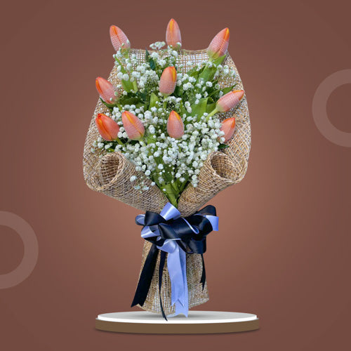 Perennial Epitome Flower Bouquet featuring 10 orange tulips and Gypsophila Baby's Breath in a harmonious arrangement.