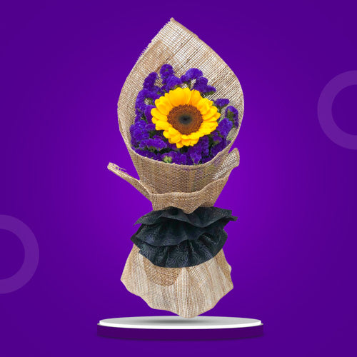 Summer Attraction: A captivating arrangement featuring a single sunflower accompanied by beautiful violet statice, elegantly wrapped in rustic burlap and tied with a delicate black tissue ribbon, evoking the charm of summer. Perfect for delivery to Ayala Malls Manila Bay and Robinsons Place Manila.