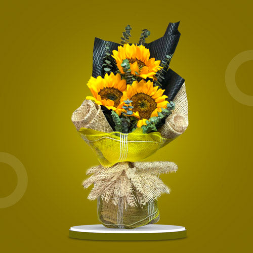 Summer Mint bouquet featuring 3 sunflowers with eucalyptus leaves, exuding warmth and freshness.