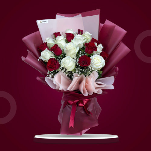 Symphony Pleasures Bouquet featuring 10 Red China Roses, 10 White China Roses, and Gypsophila Baby's Breath in a harmonious arrangement.