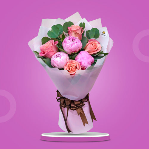 Twilight Fusion Bouquet featuring purple peonies, pomelo roses, and silver dollar eucalyptus in an elegant and artistic arrangement.