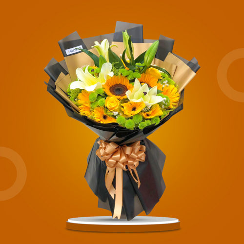 Vivaz Love bouquet with sunflower, yellow roses, stargazer lilies, gerbera daisies, green buttons, and aster fillers in a Korean-style wrap.