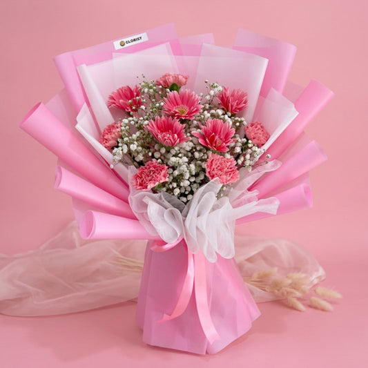 Light pink gerbera and carnation bouquet with Korean wrapper