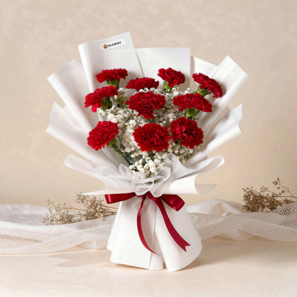 Red carnation bouquet with gypsophila baby’s breath and Korean wrapping
