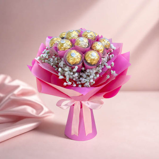 Beloved Sweets chocolate bouquet with Ferrero Rocher chocolates and baby’s breath in pink Korean wrap with light pink ribbon