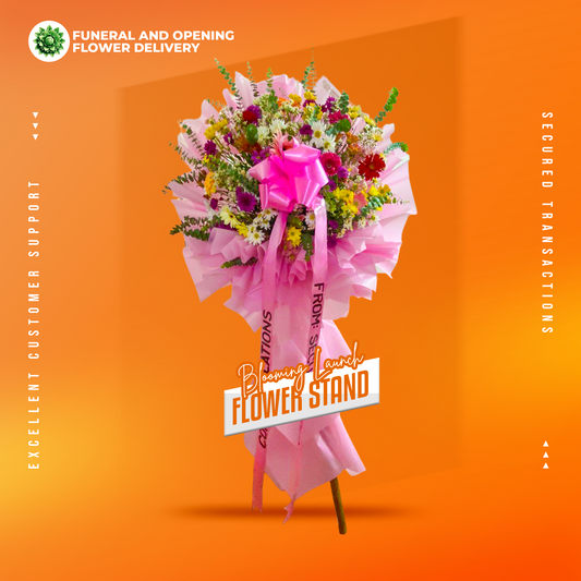 Blooming Launch Inaugural Stand with assorted gerbera daisies and eucalyptus fillers