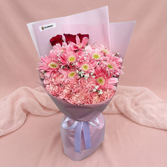 Red rose and pink gerbera bouquet with carnations and baby’s breath