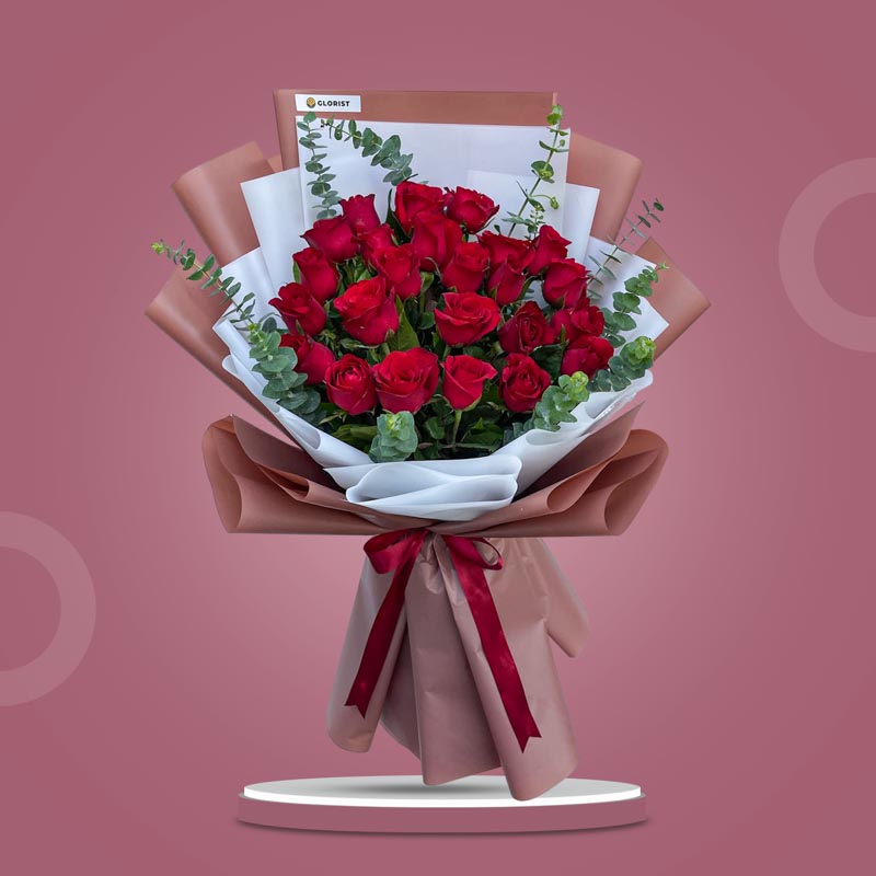 Creative Dreams bouquet with 24 red Philippine roses and eucalyptus baby blue in bean brown and white Korean wrap with maroon ribbon