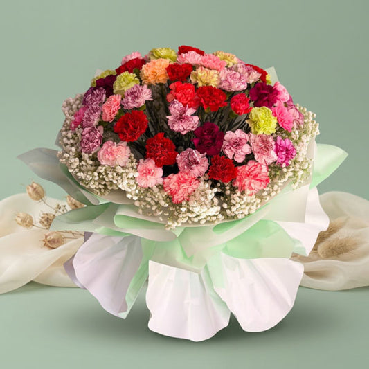 Assorted carnation bouquet with gypsophila fillers and light green wrapping