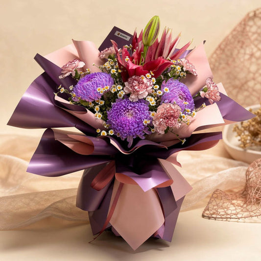 Purple sunlight and maroon stargazer flower bouquet arrangement