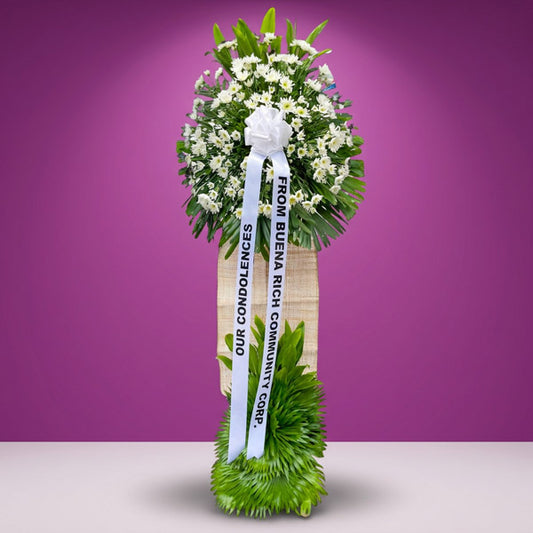 Earnest Memory Funeral Stand — sympathy tribute with white Malaysian mums, green line and anahaw leaves in elegant wrap for Metro Manila memorial services