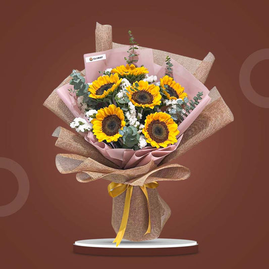 Echo Summer bouquet with sunflowers, eucalyptus baby blue, and white statice arranged by Glorist Manila