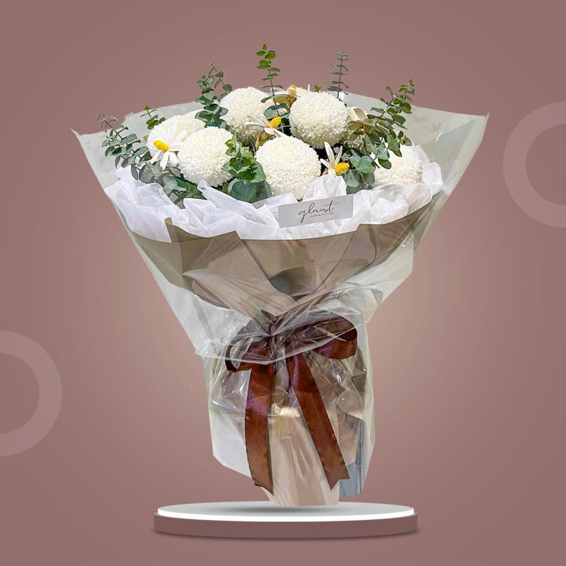 Enchanting Love bouquet with white pompom chrysanthemums, eucalyptus baby blue, and white dried daisy, wrapped in light café Korean paper with brown ribbon — same-day delivery Manila