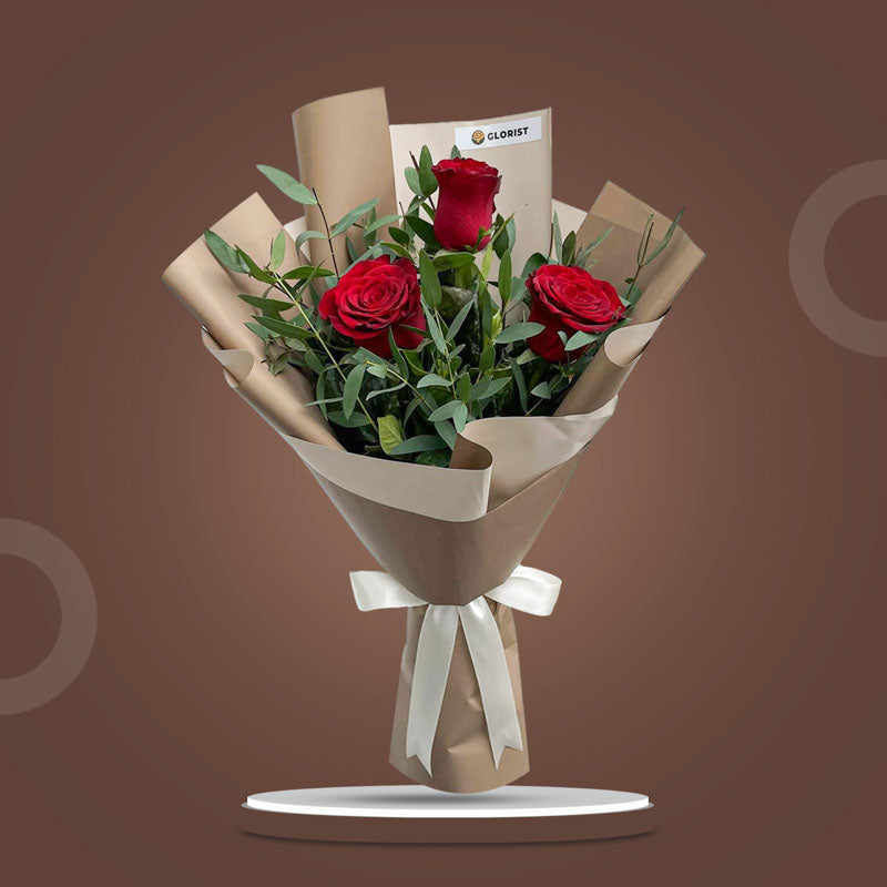 Famous Flora bouquet with 3 red China roses and eucalyptus parvifolia in café Korean wrap with latte ribbon