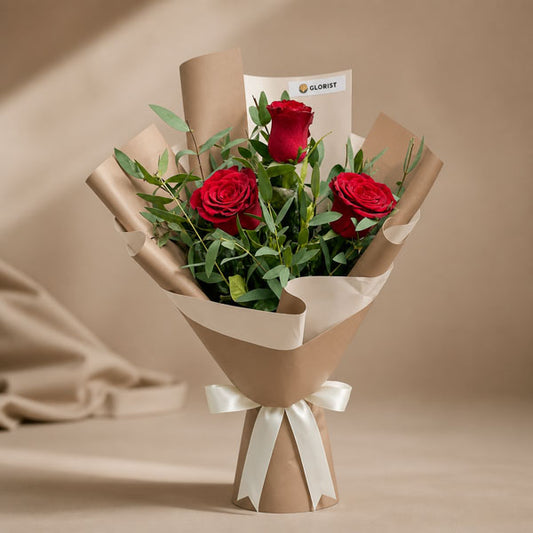 Famous Flora bouquet with 3 red China roses and eucalyptus parvifolia in café Korean wrap with latte ribbon