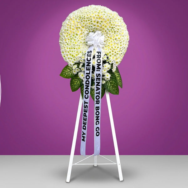 Free Memory Funeral Stand with elegant blooms and greenery for funeral tributes