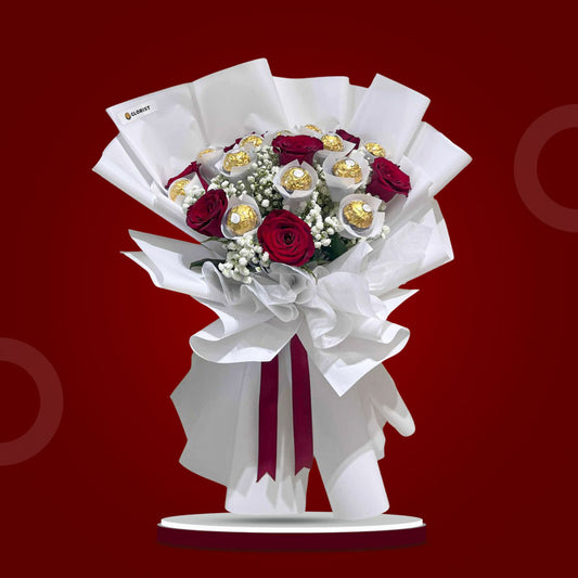 Graceful Sweets bouquet with Ferrero chocolates, red China roses, and baby’s breath wrapped in white Korean paper with maroon ribbon