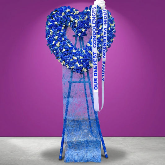 Heaven Memory Heart Funeral Stand with blue carnations and white statice flowers, sympathy floral arrangement