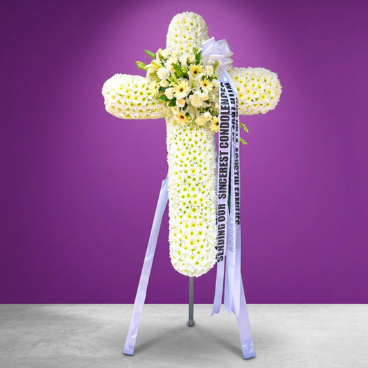 Holy Memory Funeral Stand with white Malaysian mums, white gerbera daisies, and lush greenery