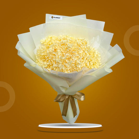 Lemon Timeless dried bouquet with light yellow hydrangea in light yellow Korean wrap and white non-woven, tied with light gold ribbon