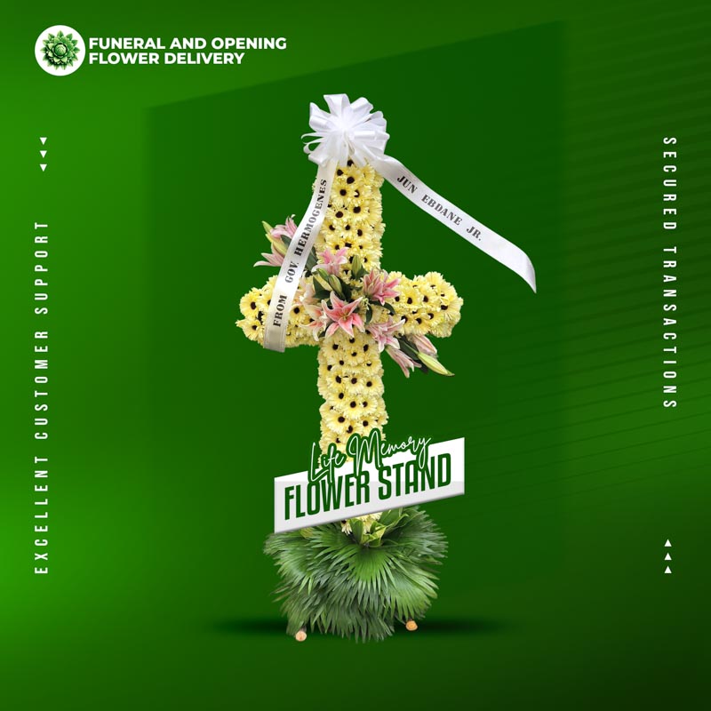 Life Memory Cross Stand with yellow gerbera daisies, stargazer lilies, and anahaw leaves